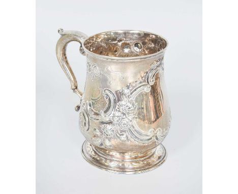 A George III Silver Mug, by William Shaw, London, 1764, baluster and on spreading foot, later chased with foliage scrolls and