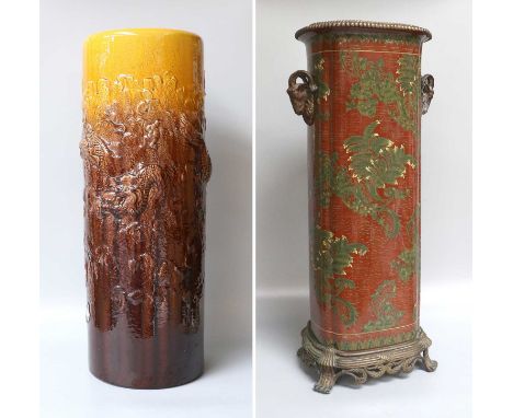 A Reproduction Pottery Stick Stand With Bronzed Metal Mounts, claret ground and enamelled with stylized foliage, together wit