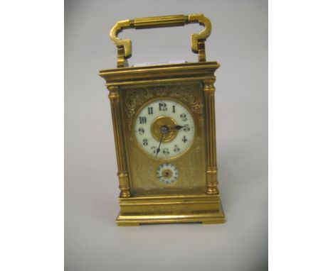 Good quality late 19th / early 20th Century brass cased carriage clock having fluted corner pilasters, the engraved brass dia