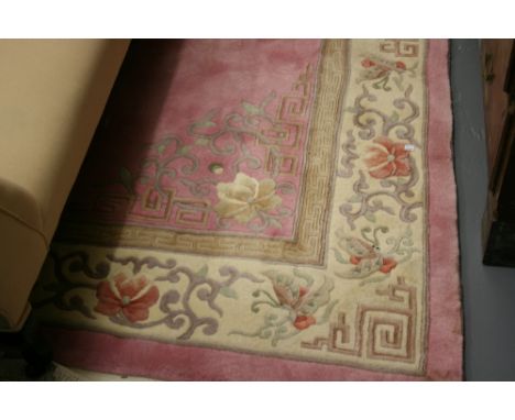 Chinese floral embossed woollen carpet on a pink ground, 124ins x 96ins