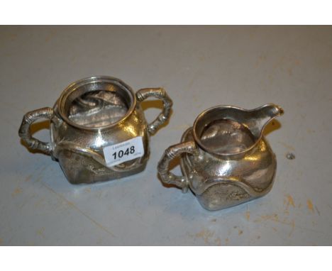 Japanese silver cream jug and sugar basin embossed with dragons with the handles simulated as bamboo