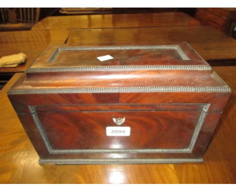 19th Century tea caddy with gadroon moulded decoration, the hinged cover enclosing central mixing compartment and two lidded 