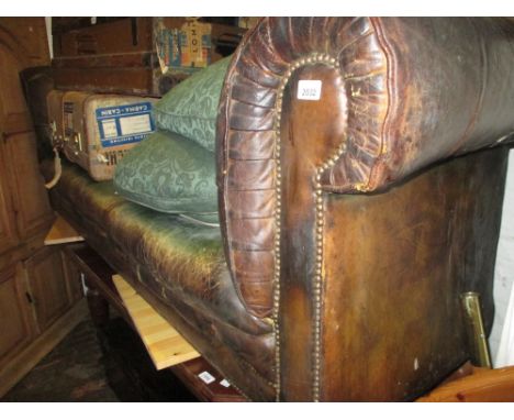 19th Century brown leather button upholstered Chesterfield sofa (with later upholstered loose cushions and lacking feet)