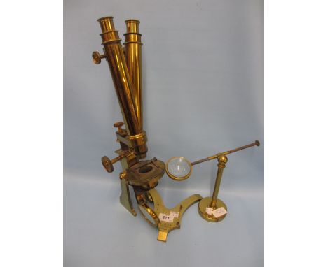 19th Century gilt brass binocular microscope by Baker, 244 High Holborn, London (for restoration) together with a bulls eye l