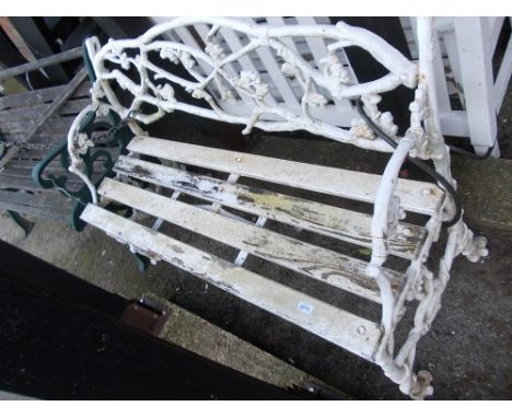 White painted cast iron and wooden slatted garden bench of intertwined branch and serpent design