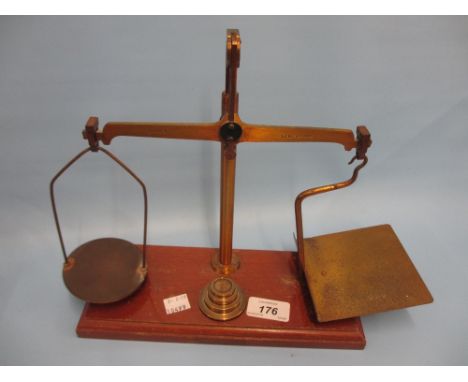 Pair of early 20th Century gilt brass and mahogany postal scales