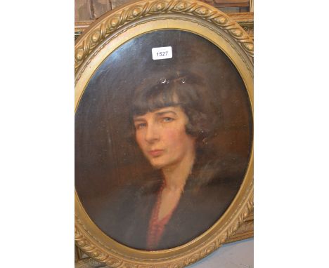 Oval oil on canvas, head and shoulder portrait of a lady wearing a fur coat and bead necklace, signed indistinctly, gilt fram