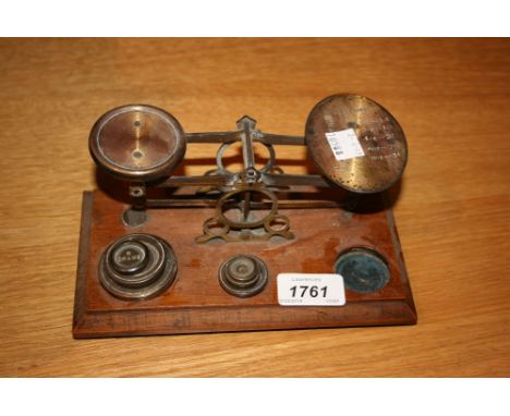 Pair of brass postal scales with graduated set of weights