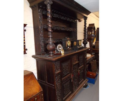 19th Century Continental carved oak buffet, the canopy top with a boarded shelf back and baluster turned upright supports, th