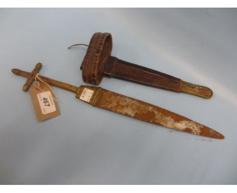 Native brass and steel dagger with cruciform grip and a leather scabbard