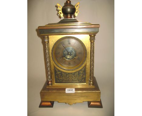 19th Century brass coppered and silvered mantel clock having circular dial with Roman numerals and two train movement strikin