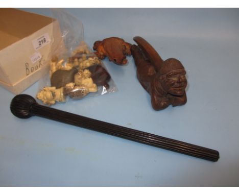 Continental nutcracker in the form of a reclining man, root carving - figure of a fish, ebony parasol handle and a bag contai