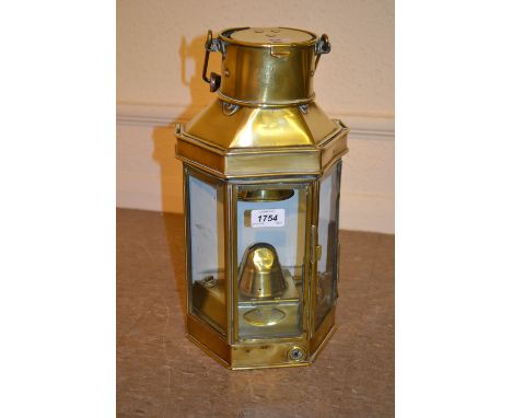 Bulpit and Sons Ltd 1916 brass ships lantern with mounting bracket, swing handle and ceramic back light with three glass pane