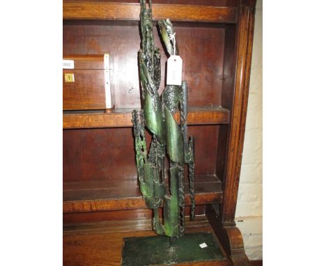 Green patinated metal work art sculpture on base with label, St. John CH12V24, 30ins high