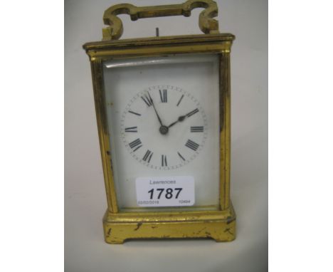 Early 20th Century brass cased carriage clock, the enamel dial with Roman numerals, the two train movement with hour repeat f
