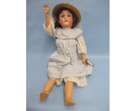 Max Handwerck, bisque headed doll No. 283 with jointed body, wearing a blue dress and with daisies on her hat