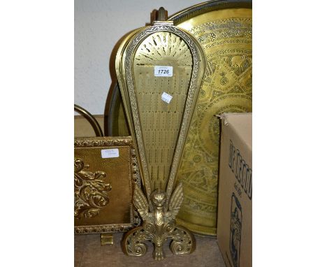 Reproduction brass fan design firescreen together with a brass magazine rack