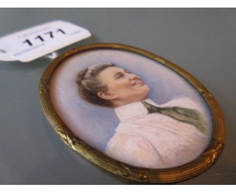 Portrait miniature of a gentleman on ivory in a white metal mount and housed in a brass and cut glass trinket box