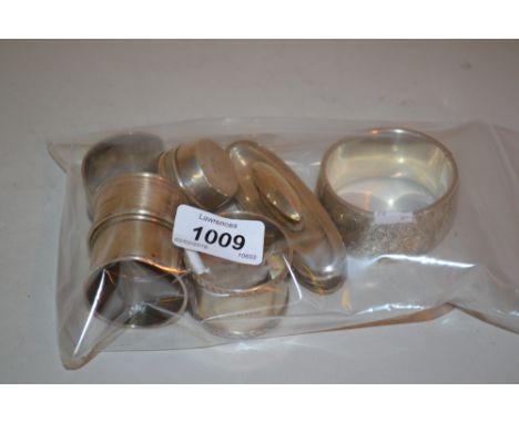 Group of four various silver napkin rings, two silver rouge pots, silver mounted nail buff and a silver engraved bangle