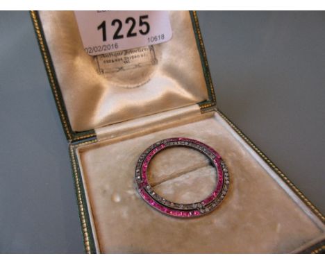 Early 20th Century ruby and diamond circular brooch in original green leather case