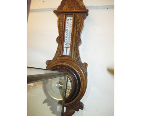 1930's Oak aneroid barometer thermometer together with a Victorian carved oak barometer / thermometer (with replacement barom