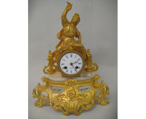 French gilt metal figural mantel clock, the dial signed Rouvier a Brignolles, mounted on an alabaster base with a two train m