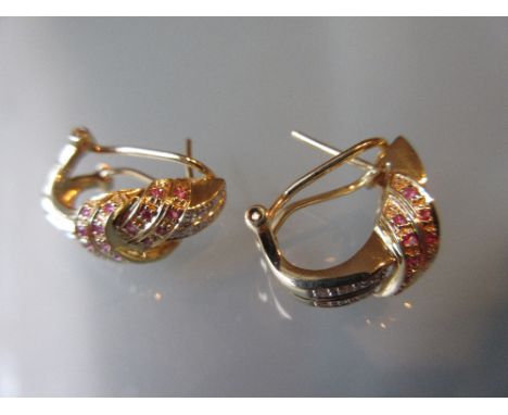 Pair of 14ct yellow gold diamond and ruby set earrings