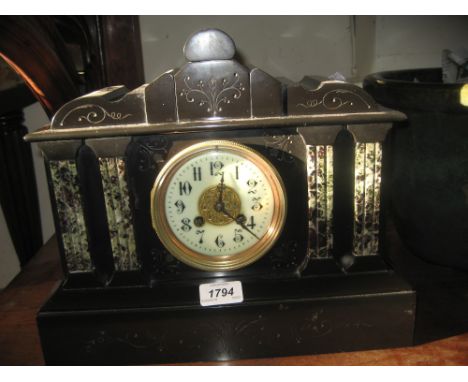 19th Century black slate and flecked marble mantel clock, the portico form case with enamel dial, Arabic numerals and two tra