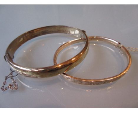 9ct Gold bangle and a silver bangle