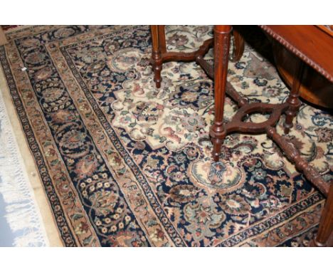 Indo Persian carpet with medallion and all-over floral design on an ivory ground