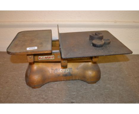 Set of gold painted iron W and T Avery balance scales with three small weights, marked G.P.O. mark II