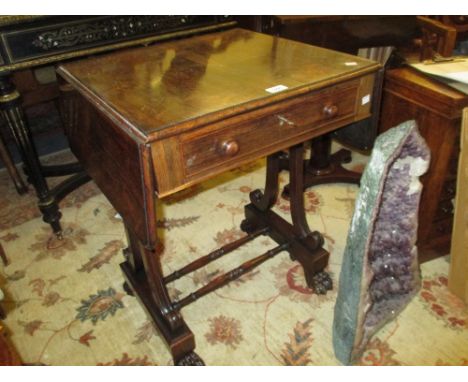 Small Regency rosewood drop-leaf sofa table with a single drawer raised on outswept moulded supports with turned stretchers w