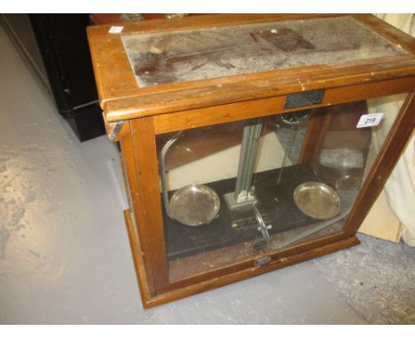 Pair of cased and glazed laboratory scales
