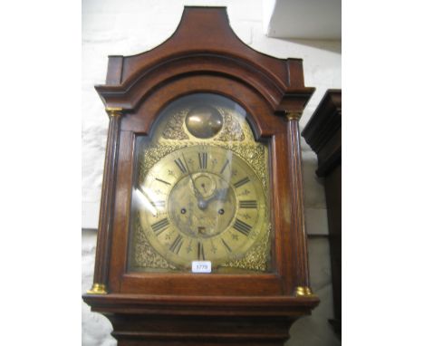 18th Century oak longcase clock, the pagoda hood enclosing a brass dial with pierced spandrels, the chapter ring having Roman