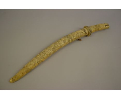 Late 19th / early 20th Century Japanese short sword, the ivory grip and scabbard finely carved with figures and animals, 27.5