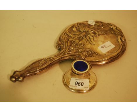 Circular capstan inkwell with blue and cream enamel decorated cover, together with a floral embossed hand mirror (a/f)
