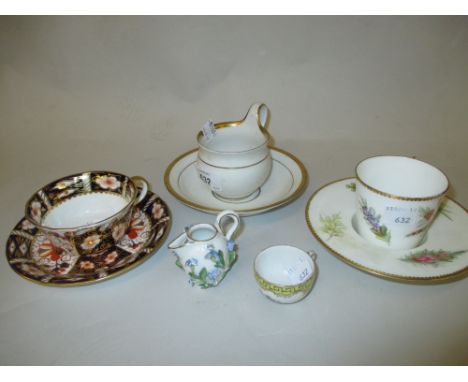 Royal Crown Derby Imari pattern cup and saucer, a Royal Worcester cup and saucer, a Meissen cup and saucer and two other cabi