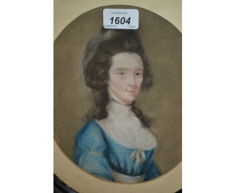 Antique oval pastel portrait of an 18th Century lady, together with a circular framed watercolour of a peasant girl