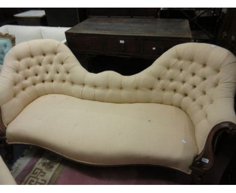 Victorian beige button upholstered double spoon back settee raised on carved mahogany cabriole supports