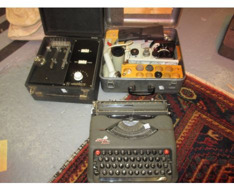 Empire Aristocrat typewriter, medical electric microscope and a cased electric shock treatment machine