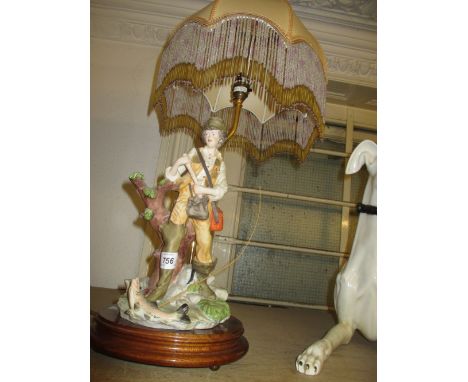 Porcelain table lamp in the form of an angler with shade