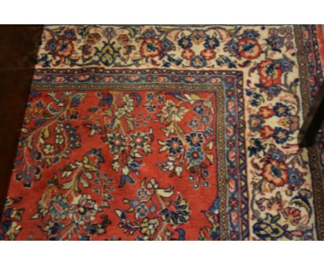 Modern Saruq carpet having all-over floral design on a pink and blue ground with multiple borders, 6ft x 10ft