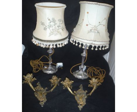 A pair of twin branch brass candelabra and a near matching pair of table lamps with embroidered shades, together with a trans