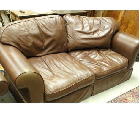 A pair of modern brown leather Laura Ashley two seat scroll arm sofas CONDITION REPORTS Both sofas have numerous surface scra