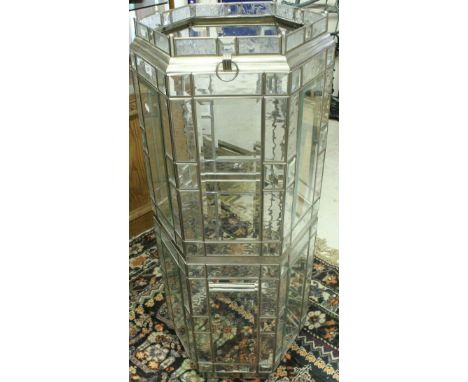 A hexagonal bevelled glass and steel framed tower ceiling light shade