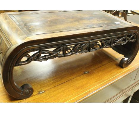 A Chinese rosewood opium table with bamboo carved frieze on scroll end supports, together with two modern occasional tables (