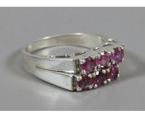 A yellow metal six stone ruby ring, size N. 