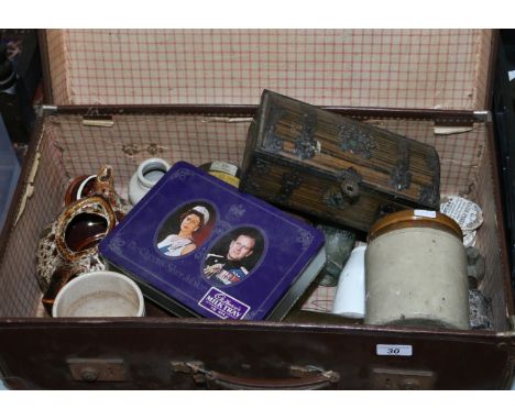 A vintage leather suitcase to include stoneware storage jars, tins, stoneware hot water bowl etc.