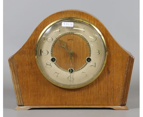 An oak cased Westminster chime mantel clock by Smiths complete with pendulum and key.