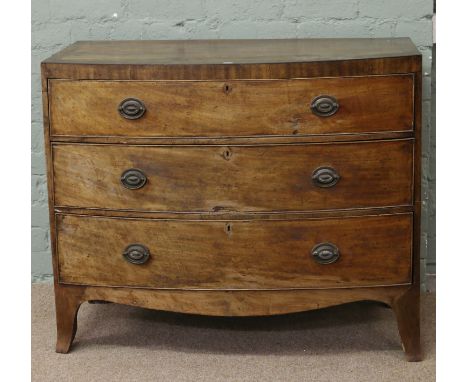 A Georgian mahogany bow front chest of drawers raised on bracket feet.